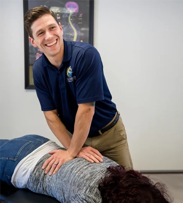 Chiropractor Milford CT CJ Cameron with Patient